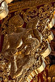 Wat Xieng Thong temple in Luang Prabang, Laos. the Ho Tai, the library. Detail of the console of the roof. 